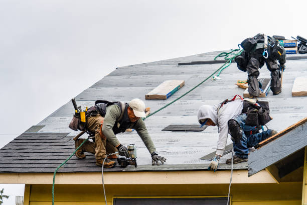 Professional Roof Replacement technician working in Justice, OK